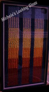 Hand finished double frames to space glass from carpet